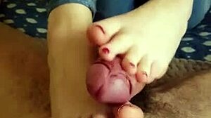 Exclusive video of footjob and cumshot on feet of young amateur redhead